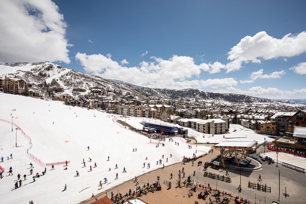A vibrant ski village nestled at the base of snow-covered slopes, where winter adventure and mountain town charm converge throughout the season.