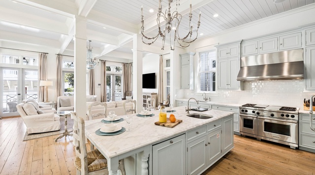 Your elegant kitchen features marble countertops, professional appliances, and flows seamlessly into the living space.