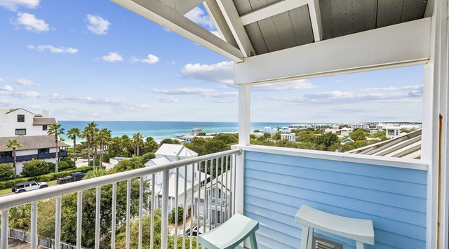 Step out onto your covered balcony and drink in the stunning turquoise waters stretching to the horizon. The coastal breeze, the peaceful neighborhood below, and those swaying palms set the stage for unforgettable mornings and serene evenings.