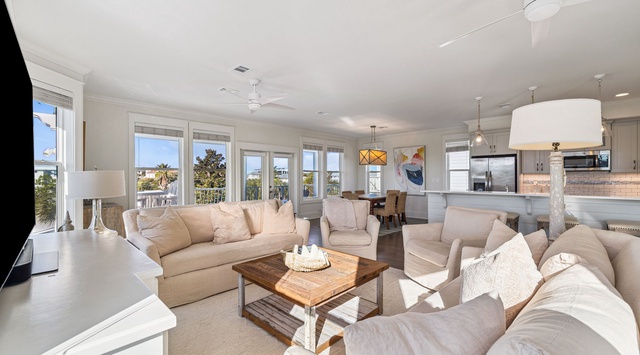 Sink into plush seating while ocean breezes flow through your bright, open-plan living space with stunning views.