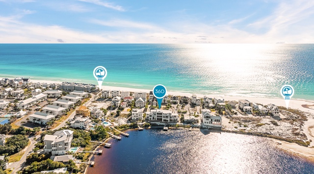 Stunning aerial view of beachfront community with pristine Gulf waters and sandy shores stretching to the horizon.