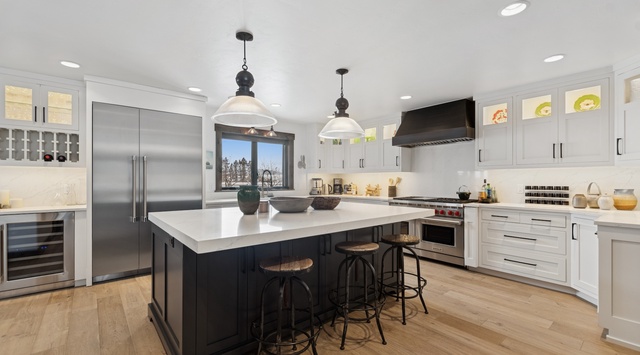 Your gourmet kitchen awaits with gleaming quartz counters, professional appliances, and a spacious island perfect for cooking memorable meals together.