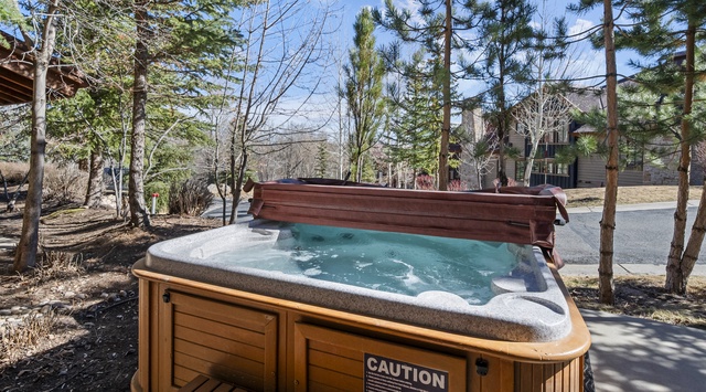 Soak your worries away in this private hot tub, surrounded by towering pines and mountain tranquility.