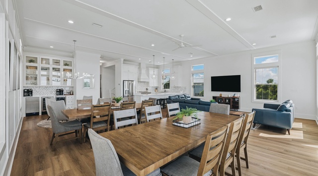 Step into this spacious open-plan retreat where your group can gather around the large dining table, relax on the plush sofas, and whip up meals in the modern kitchen—all while soaking in natural light and coastal charm.
