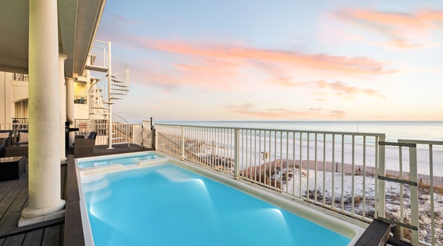 Your private pool deck offers stunning beachfront views with crystal-clear water just steps from the shore.