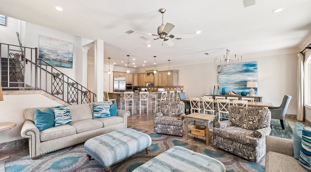 Sink into plush seating with ocean-inspired accents while your group gathers in this bright, open living space flowing seamlessly into the gourmet kitchen.