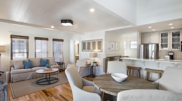 Step into your bright, open-concept living space where coastal elegance meets everyday comfort. Gather around the dining table, unwind on the plush sofa, or enjoy morning coffee at the kitchen counter—your perfect beach retreat awaits.