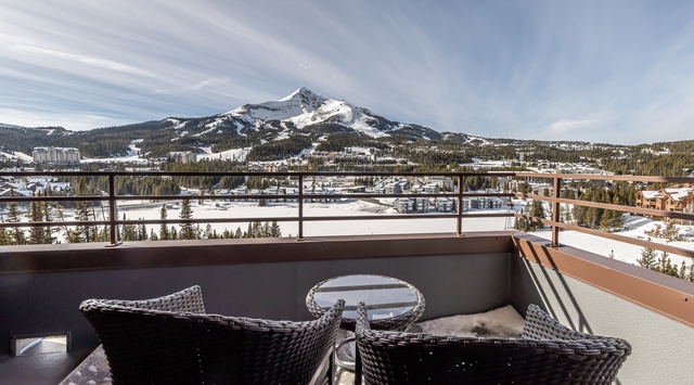 Step onto your private balcony and breathe in the crisp mountain air while taking in breathtaking panoramic views of snow-capped peaks.
