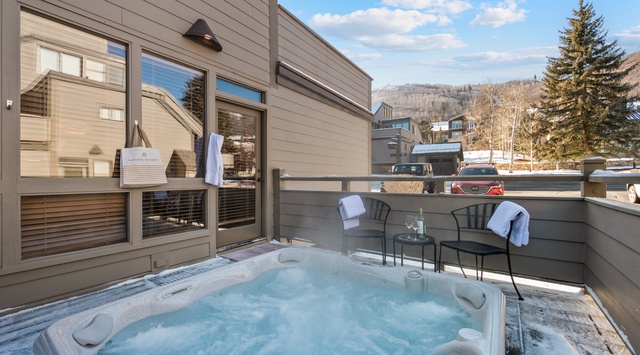 Soak in your private hot tub while mountain views create the perfect alpine backdrop for relaxation.