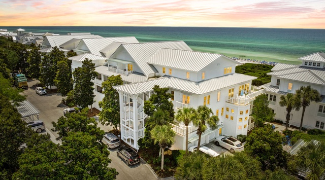 Stunning beachfront property nestled among palm trees with direct access to pristine emerald waters and sugar-white sand beaches.