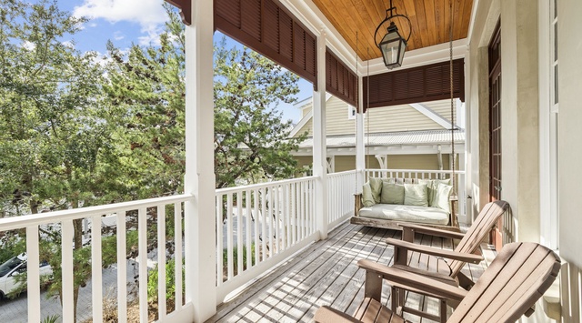 Sink into your private porch swing with morning coffee, surrounded by beautiful wood details and peaceful neighborhood views.