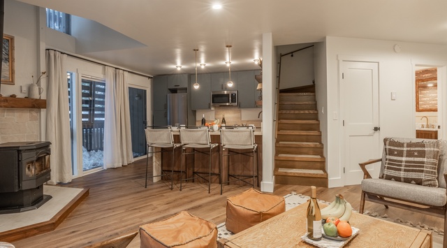 Settle into your stylish mountain retreat where warm wood tones and modern design create the perfect alpine atmosphere.