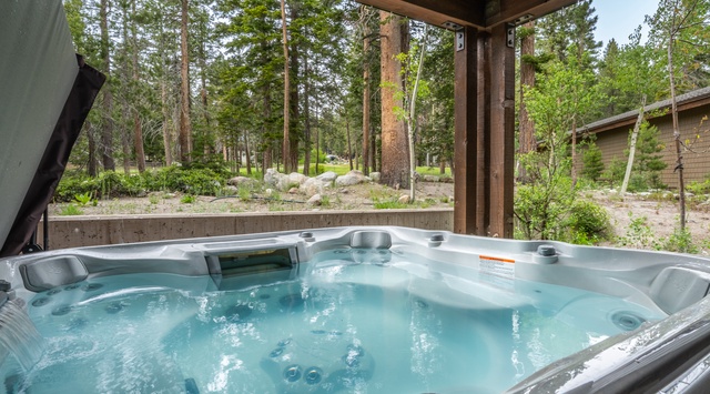 Soak away your cares in your private hot tub, surrounded by towering pines and peaceful forest views—your perfect mountain retreat awaits.