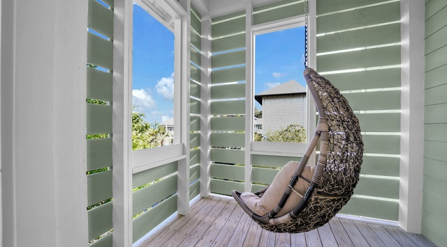 Settle into your private hanging chair and let the coastal breeze wash over you. This secluded nook is perfect for morning coffee or losing yourself in a good book.