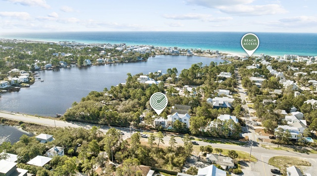 Aerial view showcasing the property's prime location near pristine beaches and emerald waters in this charming coastal community.
