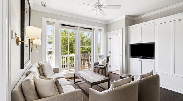 Relax in your bright living room with plush seating and French doors opening to your private balcony.