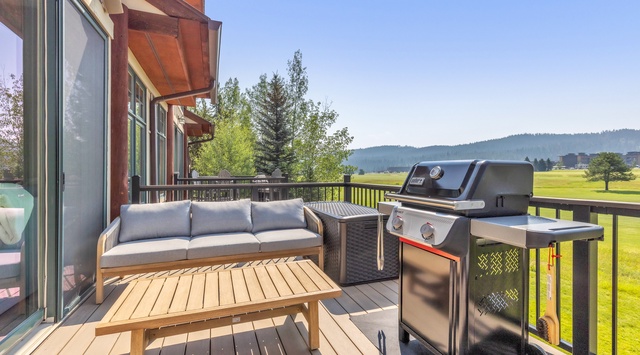 Step onto your private deck and breathe in the fresh mountain air. Enjoy morning coffee on the cozy outdoor sofa or fire up the BBQ for a scenic afternoon cookout overlooking lush green fairways and forested hills.