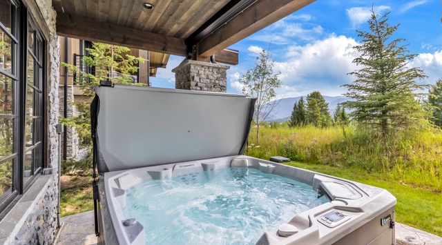 Soak in your private hot tub under the covered patio while gazing at mountain meadows and evergreens—a perfect retreat after a day of adventure.