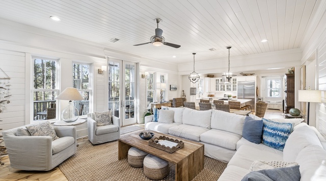 Unwind in your bright, coastal living space featuring plush seating and an open flow to your private dining area and kitchen.
