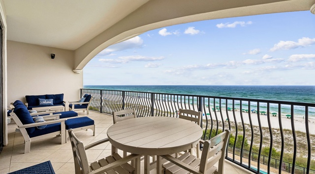 Relax on your private balcony with breathtaking views of turquoise waters and white sand beaches. Comfortable seating invites you to unwind while enjoying coastal breezes and endless horizons.