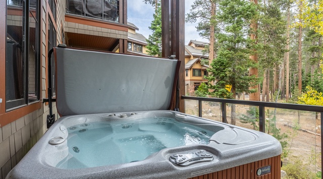 Soak in your private hot tub while surrounded by towering pines and mountain air—perfect for unwinding after a day of adventure.