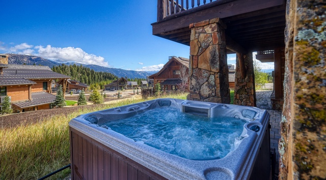 Soak in your private hot tub while gazing at stunning mountain views and alpine chalets in this serene countryside setting.