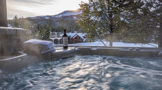 Soak in the hot tub with a glass of wine as snow-capped peaks and evergreen forest create your perfect alpine backdrop.