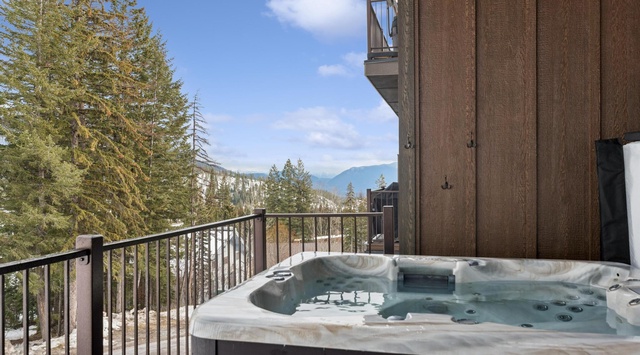Soak in bubbling warmth while gazing at snow-capped peaks from your private balcony hot tub.