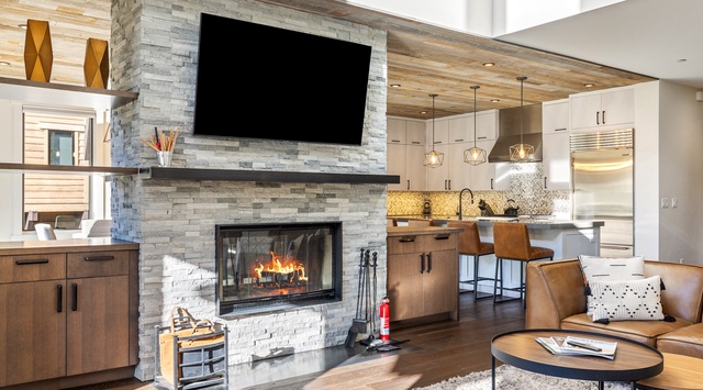 Gather by the warmth of your stone fireplace while modern finishes and open design connect your living space to a fully-equipped kitchen—perfect for relaxing evenings or entertaining friends.