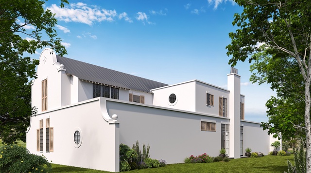 Modern white vacation home with distinctive architectural details, set on a manicured lawn surrounded by mature trees and landscaped gardens in a peaceful natural setting.