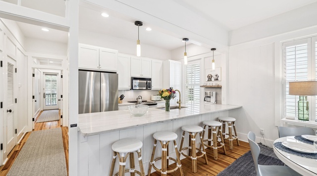 Your bright, modern kitchen awaits with marble countertops, stainless appliances, and a spacious island perfect for morning coffee or evening conversations.