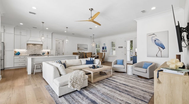 Relax in your bright, open living space where coastal comfort meets modern elegance. Soft seating, warm wood floors, and breezy accents invite you to unwind in style.