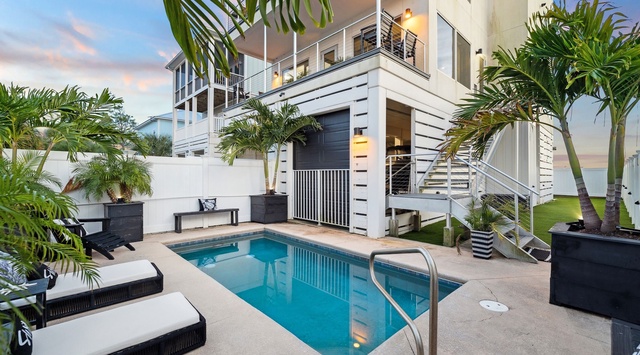 Dive into your private pool surrounded by swaying palms as the sunset paints the sky in perfect tropical hues.