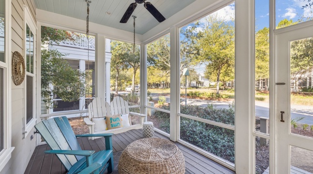 Your screened porch offers the perfect spot to unwind with morning coffee or evening conversations, surrounded by windows and gentle breezes from the ceiling fan.