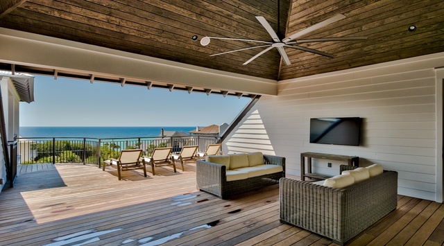 Relax in your private covered terrace with stunning sea views, comfortable seating, and ocean breezes.