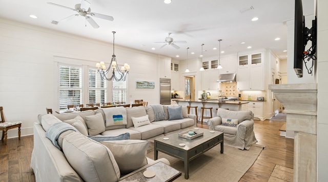 Unwind in this bright open-concept space where your plush sectional sofa faces a chef's kitchen, perfect for relaxing evenings.