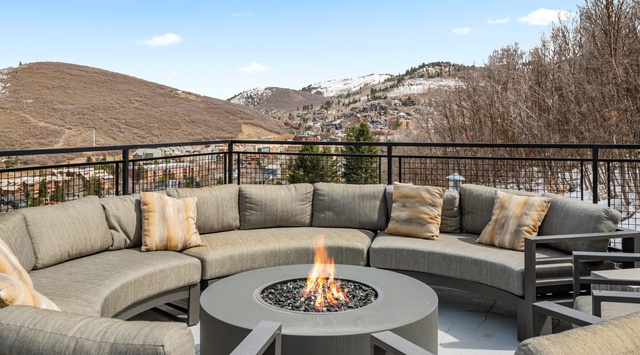 Gather around the fire pit on your private terrace, where cozy seating and mountain views create the perfect setting for memorable evenings.