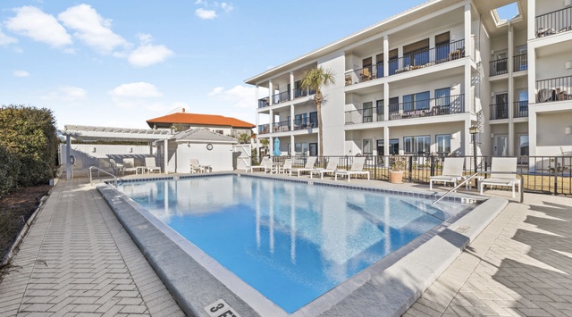 Dive into crystal-clear waters surrounded by modern comfort. Your private oasis awaits with pristine pool and sunny balcony views.