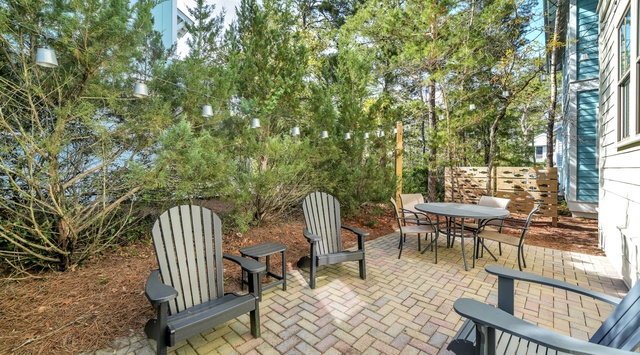 Settle into your private patio surrounded by towering pines and natural landscaping.