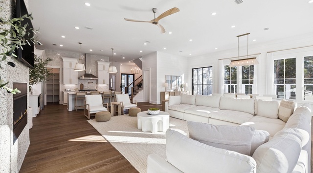 Unwind in your spacious open-concept living room, where plush seating and natural light create the perfect atmosphere for relaxation.