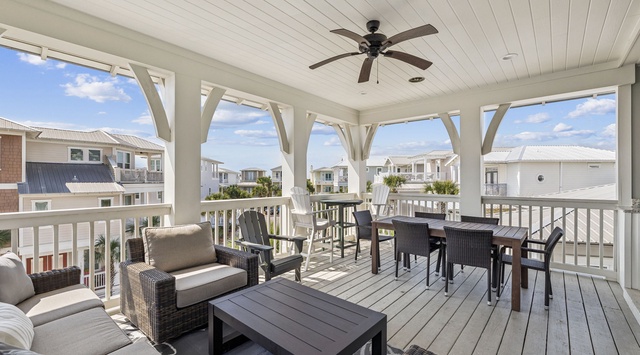 Relax on your spacious covered deck with comfortable seating and dining areas, perfect for morning coffee or evening meals.