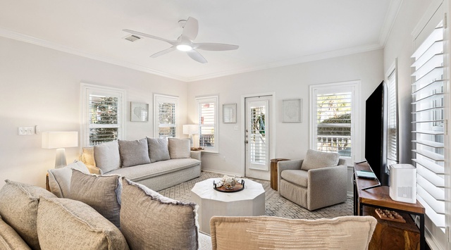 Unwind in your spacious living room with plush seating, perfect for movie nights or relaxing conversations with loved ones.