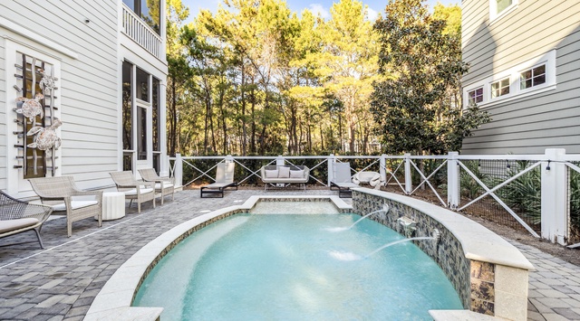Picture yourself lounging poolside, surrounded by golden autumn trees and peaceful woodland views. Your private heated pool and spacious patio seating invite you to unwind under the open sky.