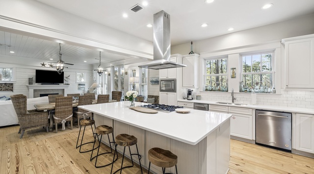 Gather around the spacious island in this bright, open kitchen where you'll create meals together and share stories over morning coffee.