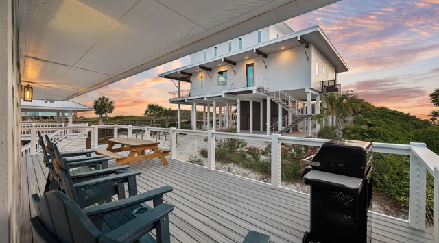 This spacious beachfront deck offers your perfect spot for sunset barbecues, with comfortable seating for the whole group and stunning coastal views stretching endlessly before you.
