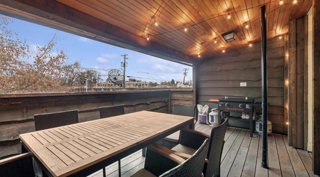 Your private covered terrace awaits with warm string lights, dining space, and BBQ ready for memorable evenings under the stars.