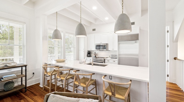 Gather around your bright, airy kitchen island where exposed beams and natural light create the perfect space for cooking and connecting.