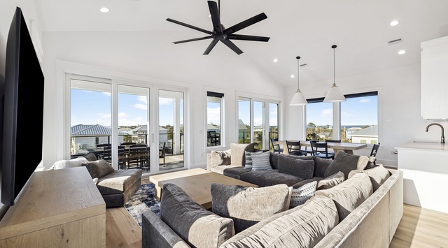 Relax in this bright, open living space with panoramic windows flooding the room with natural light and stunning views.