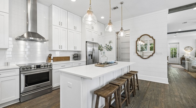 Step into your bright, modern kitchen where cooking becomes a pleasure. The spacious island invites you to gather with family while preparing meals on professional-grade appliances.