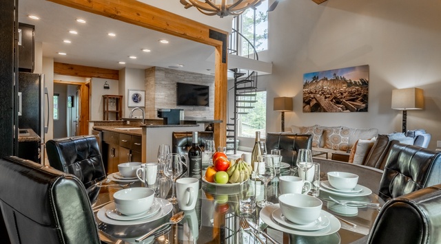 Picture your group gathered around this stunning dining table, sharing stories and laughter under soaring timber beams. The open-concept design flows seamlessly into your gourmet kitchen and cozy living area.
